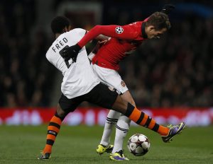 Adnan Januzaj (R) is challenged by Shakhtar Donetsk's Fred during their Champions League soccer match at Old Trafford.