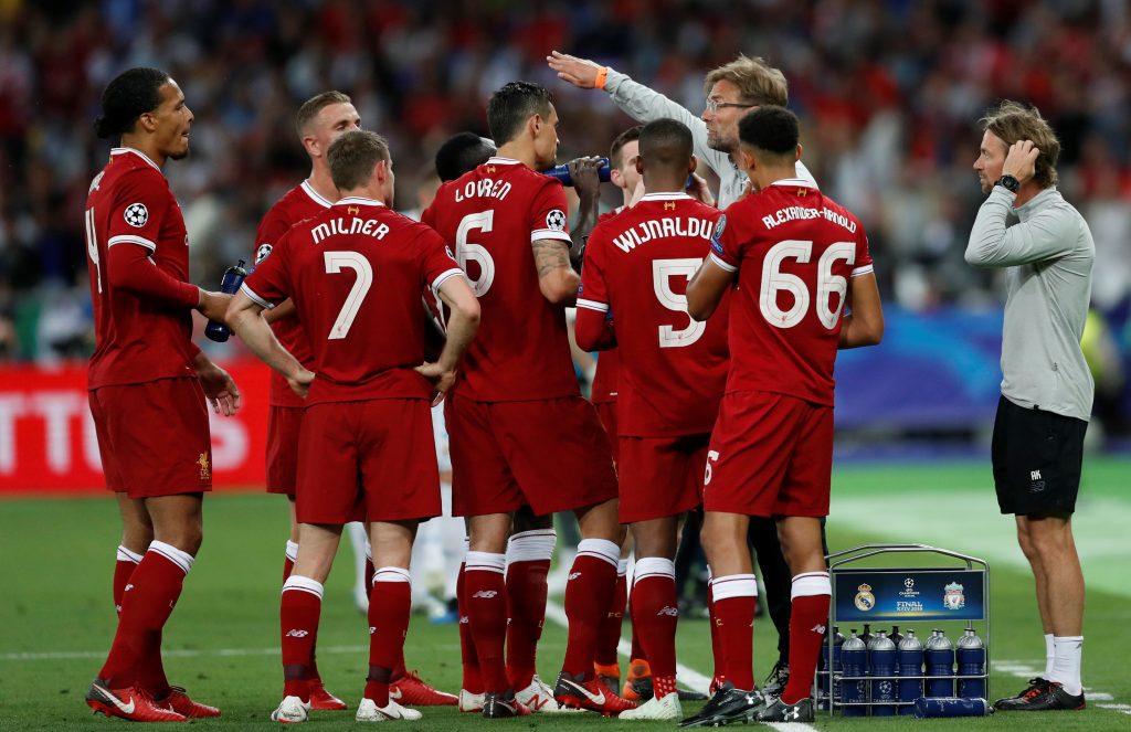 Liverpool manager Jurgen Klopp gives instructions to Liverpool players during a break in play.