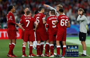 Liverpool manager Jurgen Klopp gives instructions to Liverpool players during a break in play.