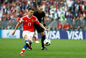 Russia's Aleksandr Golovin scores their fifth goal from a free kick.