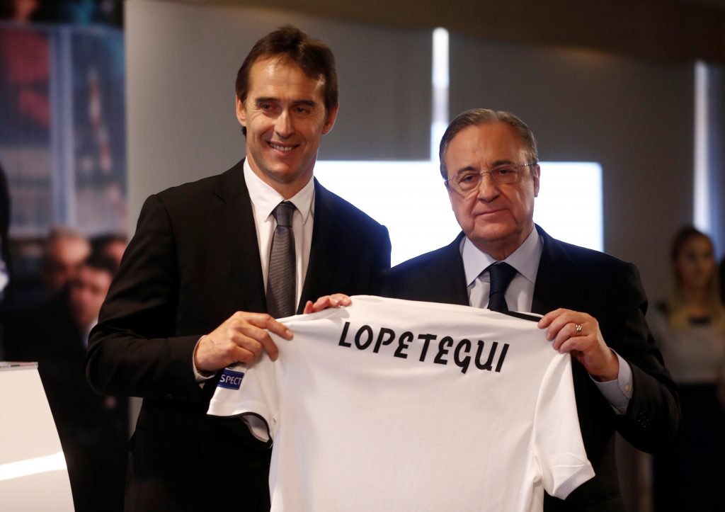 New Real Madrid coach Julen Lopetegui poses with the shirt with president Florentino Perez during the presentation.