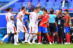 Serbia's Sergej Milinkovic-Savic separates Nemanja Matic and Costa Rica's Daniel Colindres following a clash.
