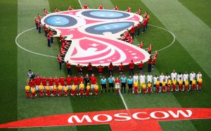 General view of both teams and officials lined up before the match.
