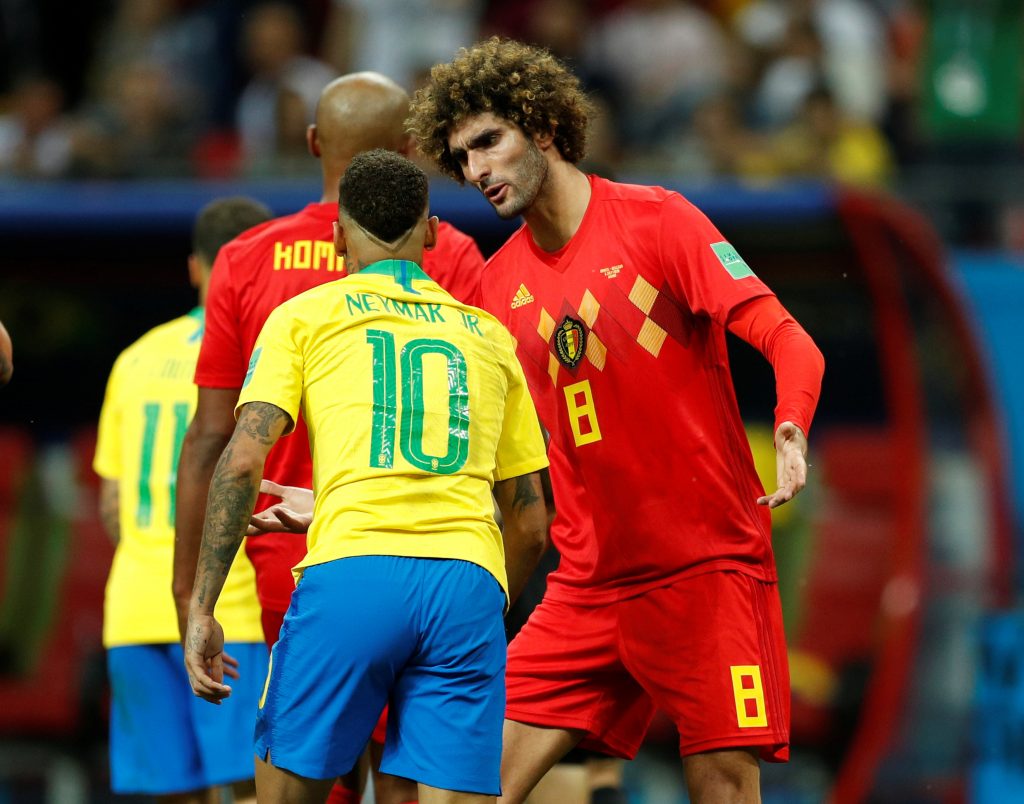 Belgium's Marouane Fellaini with Brazil's Neymar.