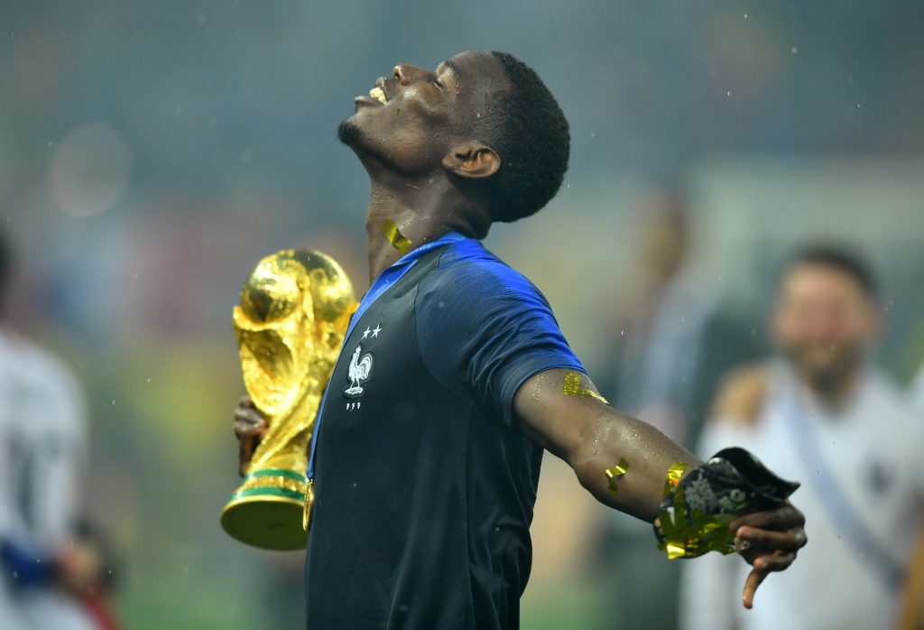 France's Paul Pogba holds the trophy as he celebrates winning the World Cup.