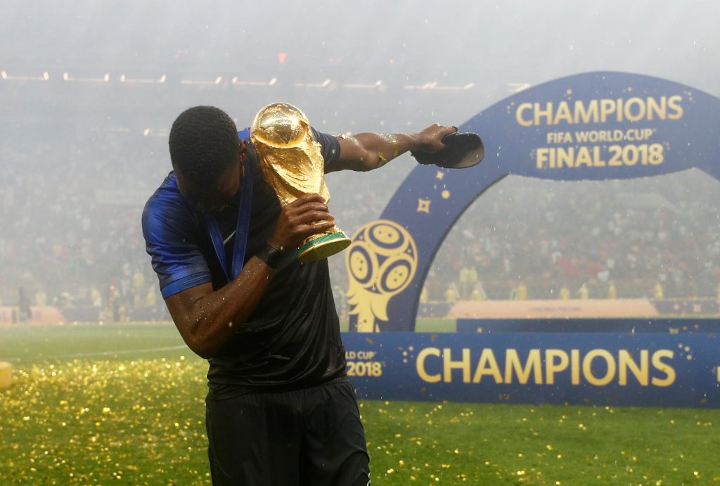 France's Paul Pogba celebrates with the trophy after winning the World Cup.