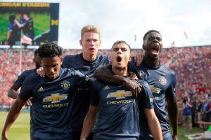 Manchester United's Andreas Pereira celebrates scoring their first goal with team mates.