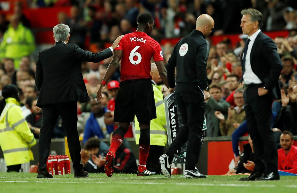 Manchester United's Paul Pogba with Manchester United manager Jose Mourinho after being substituted.