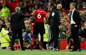 Manchester United's Paul Pogba with Manchester United manager Jose Mourinho after being substituted.