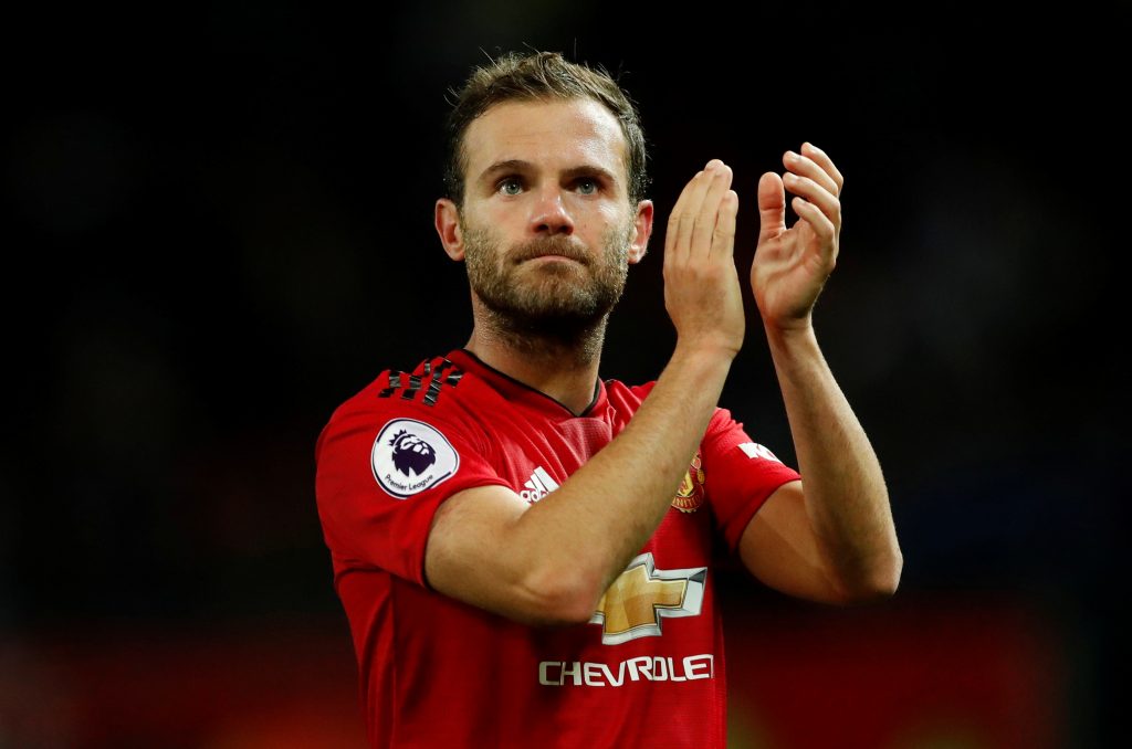 Manchester United's Juan Mata applauds fans after the match.