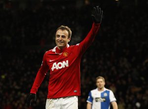 Dimitar Berbatov celebrates scoring the seventh goal for Manchester United.