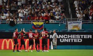 Manchester United teammates celebrate the goal of forward Alexis Sanchez (7) against Real Madrid during the first half of an International Champions Cup soccer match.