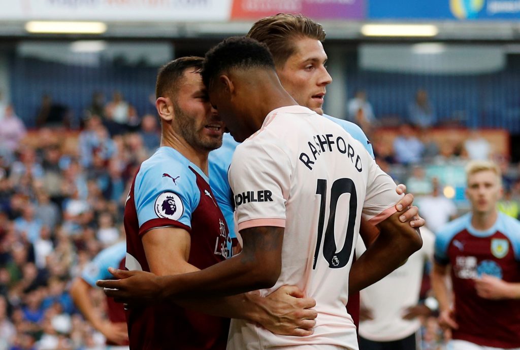 Burnley's Phil Bardsley clashes with Manchester United's Marcus Rashford.