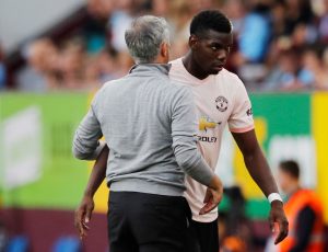 Manchester United's Paul Pogba with manager Jose Mourinho after being substituted off.
