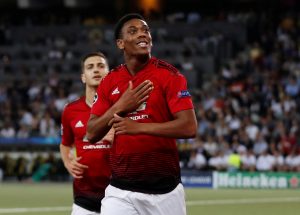 Manchester United's Anthony Martial celebrates scoring their third goal.