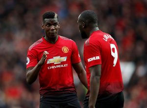 Manchester United's Paul Pogba speaks with Romelu Lukaku.