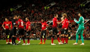 Man Utd players react after Sergio Romero is shown a red card.