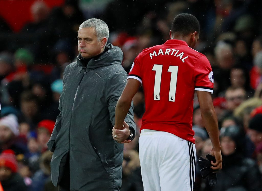 Manchester United's Anthony Martial walks past manager Jose Mourinho as he is substituted.