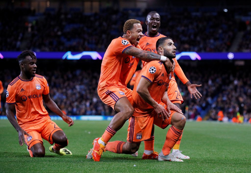 Lyon's Nabil Fekir celebrates scoring their second goal with teammates.