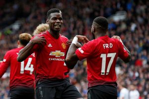Manchester United's Fred celebrates scoring their first goal with Paul Pogba.