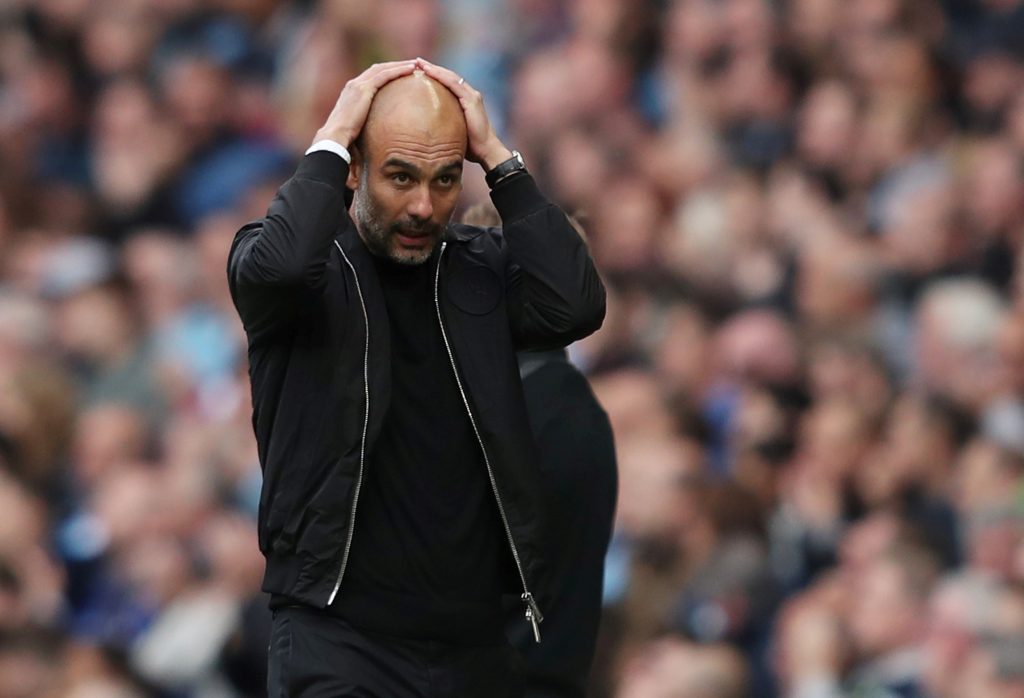 Man City manager Pep Guardiola reacts during the match.