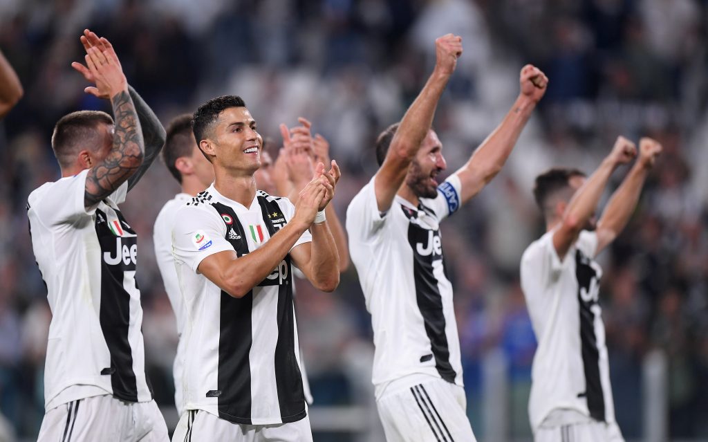 Juventus' Cristiano Ronaldo applauds fans after the match with team mates.