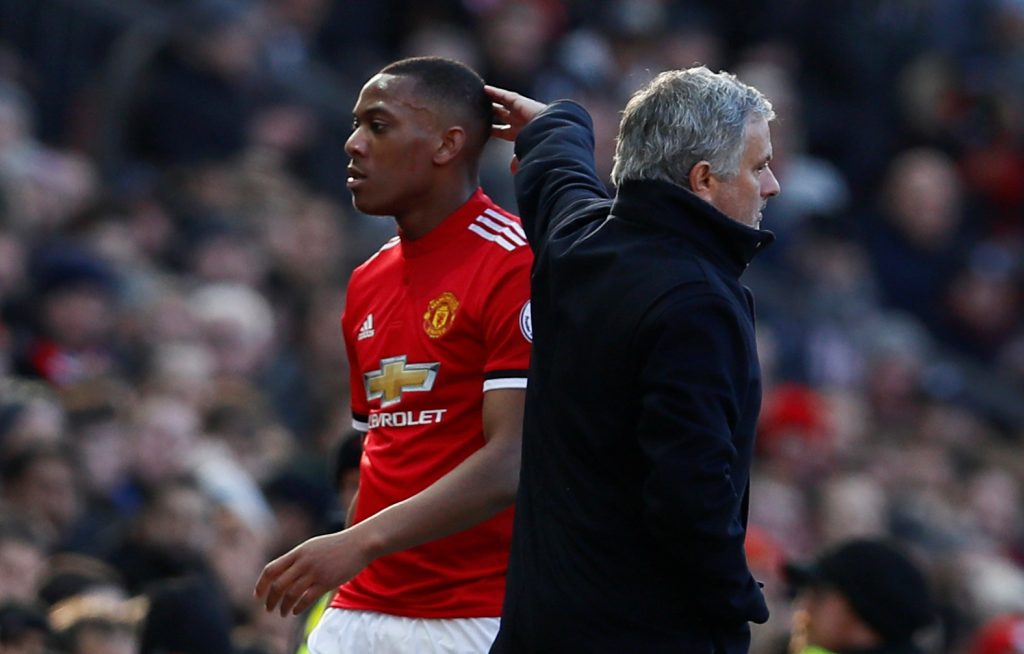Manchester United's Anthony Martial walks past manager Jose Mourinho as he is substituted.