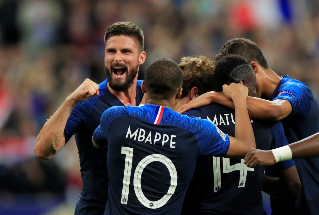 France's Antoine Griezmann celebrates scoring their second goal with teammates.