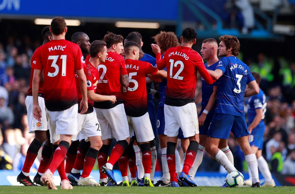 Players clash during the match.