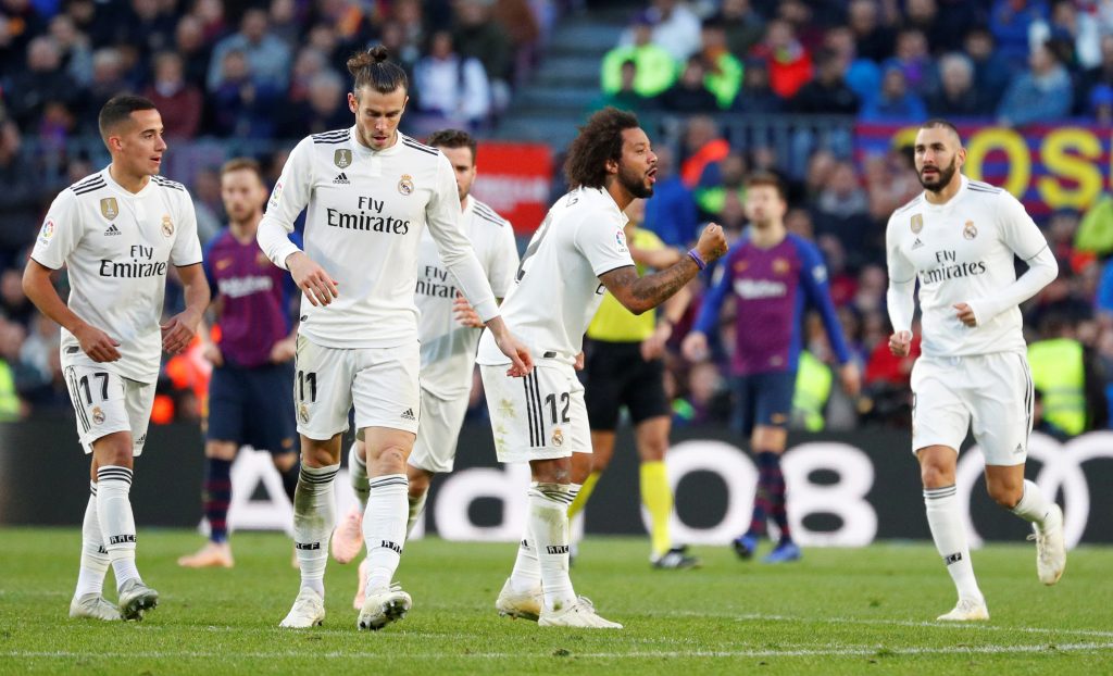 Real Madrid's Marcelo celebrates scoring their first goal with Lucas Vazquez and team mates.