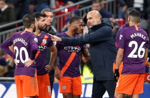 Man City manager Pep Guardiola with Bernardo Silva, Sergio Aguero and team mates.