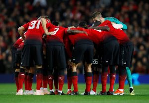 Manchester United team huddle before the match.
