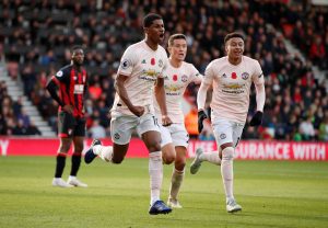 Manchester United's Marcus Rashford celebrates scoring their second goal with Jesse Lingard and Ander Herrera.