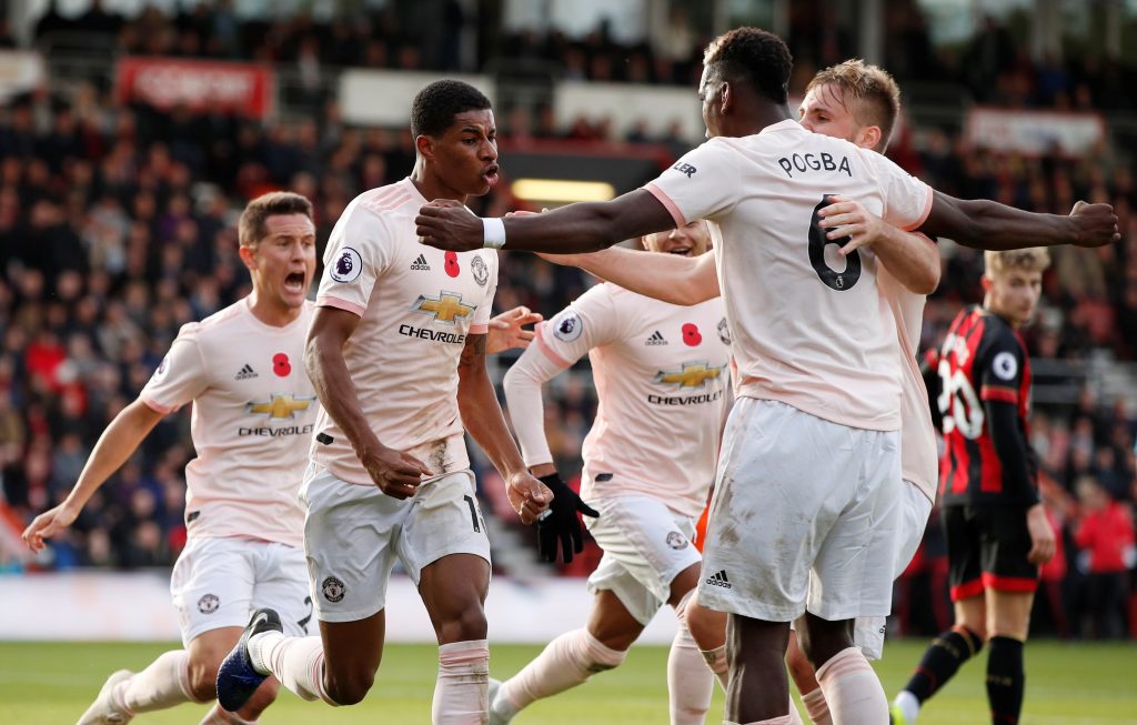 Manchester United's Marcus Rashford celebrates scoring their second goal with team mates.