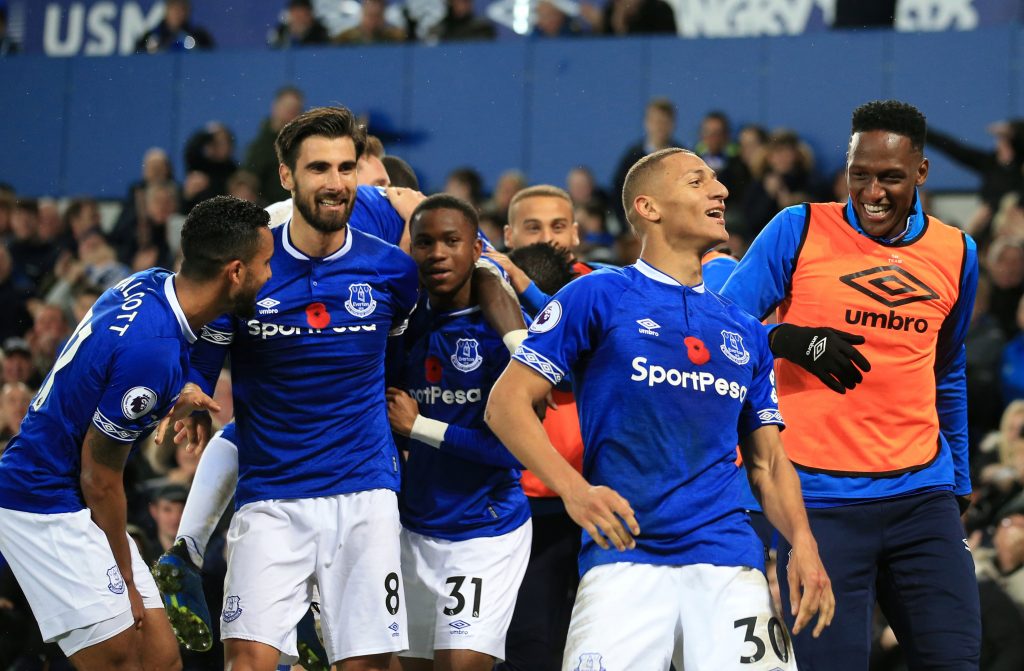 Everton's Richarlison celebrates scoring their third goal with teammates.