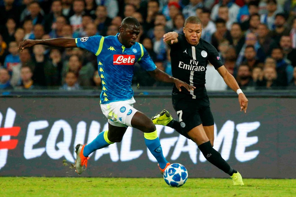 Napoli's Kalidou Koulibaly in action with PSG's Kylian Mbappe.