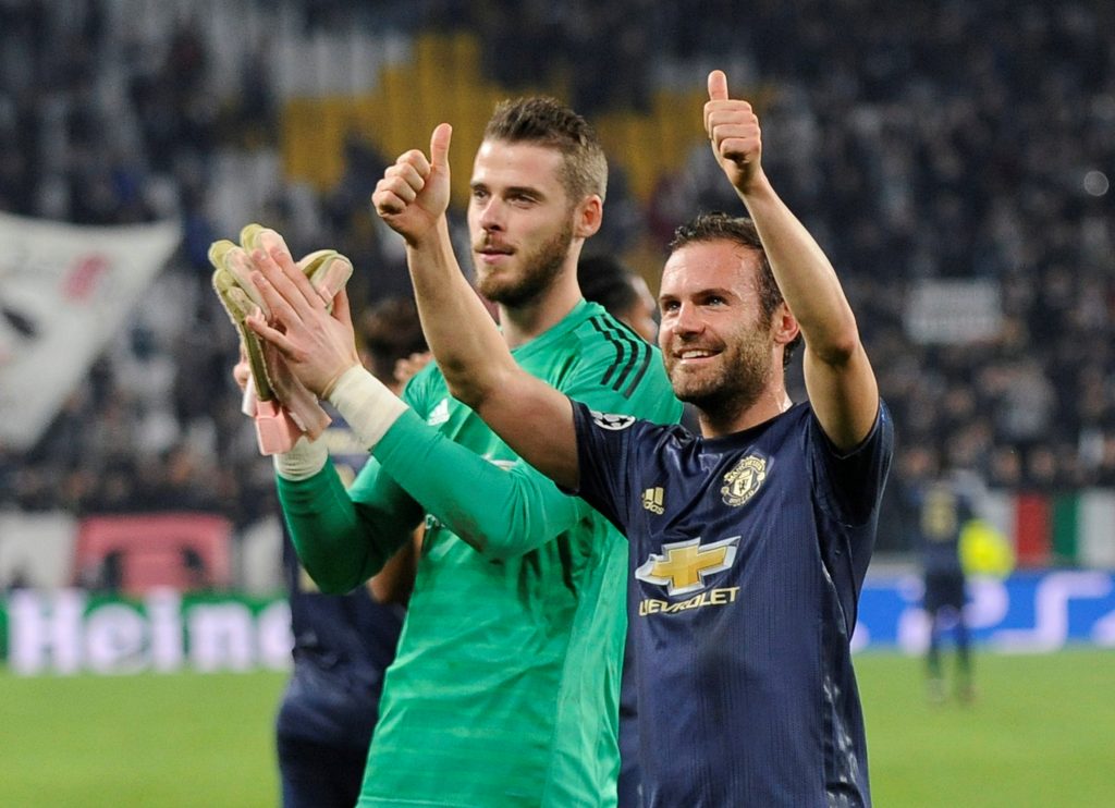 Manchester United's David de Gea and Juan Mata celebrate after the match.