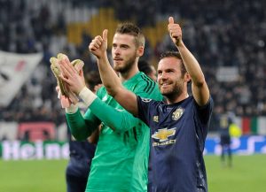Manchester United's David de Gea and Juan Mata celebrate after the match.