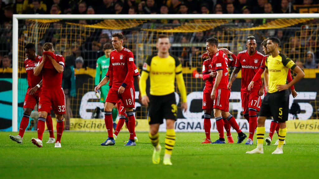 Bayern Munich's Robert Lewandowski celebrates scoring their first goal with team mates.
