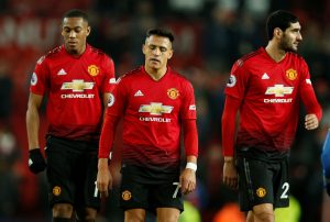 Manchester United's Anthony Martial, Alexis Sanchez and Marouane Fellaini look dejected after the match.