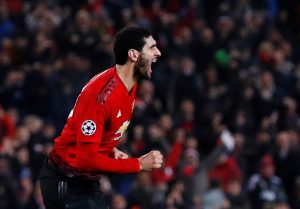 Manchester United's Marouane Fellaini celebrates scoring their first goal.