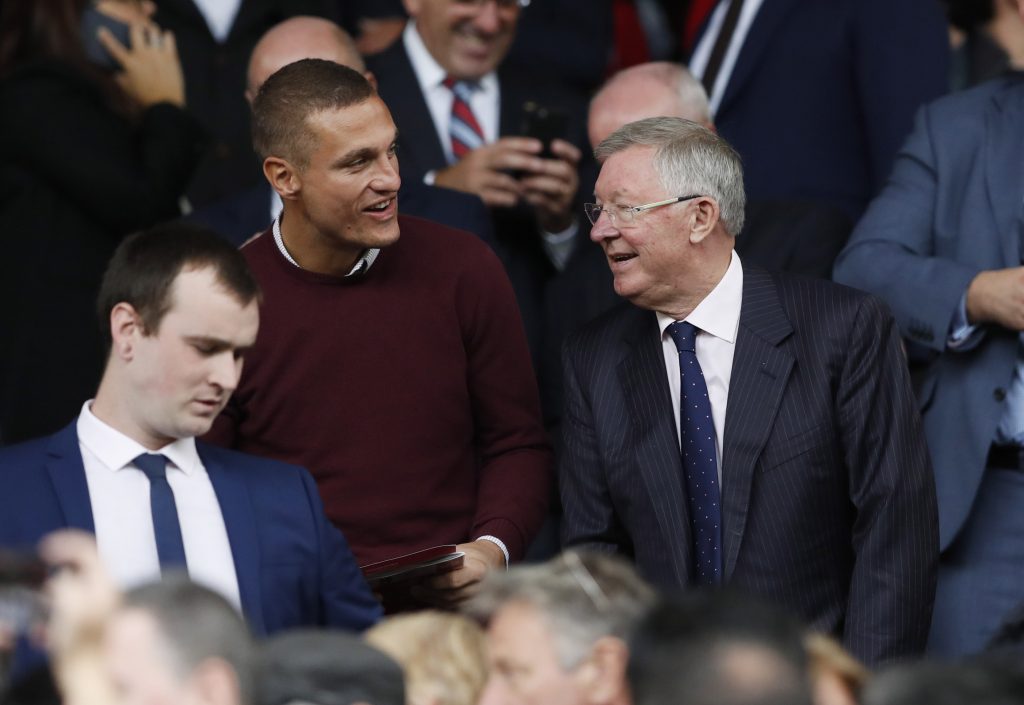 Sir Alex Ferguson and Nemanja Vidic in the stands.