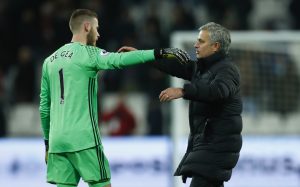 Manchester United manager Jose Mourinho and David De Gea celebrate after the game.