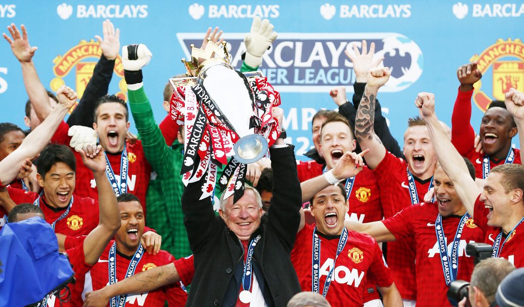 MUFC manager Sir Alex Ferguson (C) celebrates winning the Barclays Premier League.