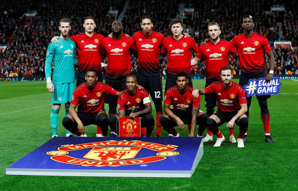 Man Utd players pose for a team group photo before the match.