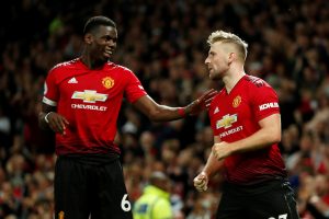 Manchester United's Luke Shaw celebrates scoring their second goal with Paul Pogba.
