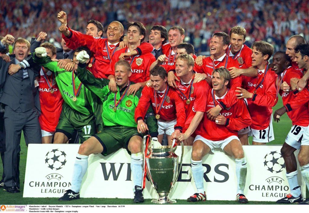 Manchester team with the Champions League trophy.