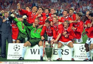 Manchester team with the Champions League trophy.