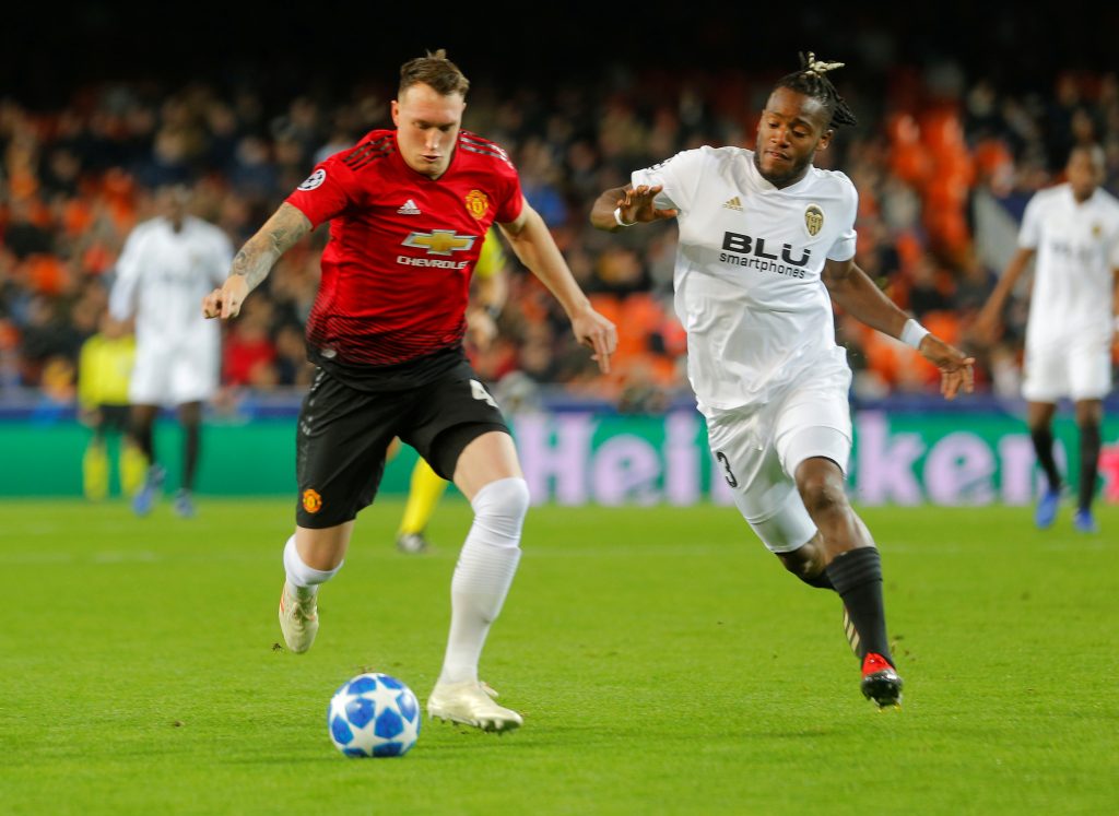 Manchester United's Phil Jones in action with Valencia's Michy Batshuayi.