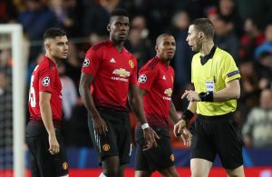 Man United's Andreas Pereira, Paul Pogba, Ashley Young and referee Georgi Kabakov look on.